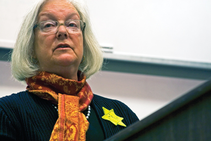 Holocaust survivor Louise Lawrence-Israels during a speech she gave on the Mesa State campus Thursday night. Lawrence-Israels, who was born in Haarlem, Holland, in the middle of World War II, bears the golden Star of David that the Nazis all Jews to wear for identification.
