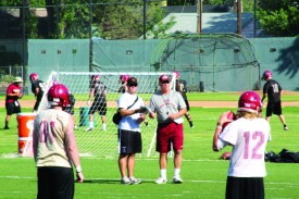 Coach Martin looks on as players participate in first practice of season.  Photo: Matt Friesen