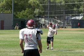 Quarterback Austen Fales throws a pass to a teammate during practice.