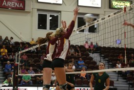 Melissa Hess and Jordyn Moody attempt a block against Black Hills State on Saturday night.