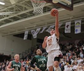 Mike Melillo attempts a layup against Adams State on Friday. The Mavs lost 68-75.