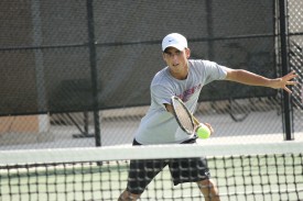 Freshman Andres Garcia-Rojas forehands a ball during practice last week. He is one of eight freshmen on the roster this year for the men's team.