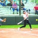 Junior outfielder Rachel Boothe swings on a pitch as softball defeated the wrestlers in a charity event at Bergman Field.