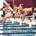 CMU swimmers, past and present, dive into the pool during one of the events at the Maroon and Black Intersquad/Alumni Meet on Saturday.