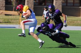 Freshman receiver Daniel Perse avoids a tackler during Saturday's five-point win over New Mexico Highlands. He had one reception (his sixth of the season) for eight yards as the offense uncharacteristically relied more on the passing game.