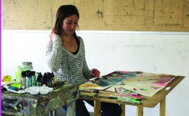 Salina Kirk works on a multimedia art project in a drawing workshop class.