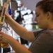 The Point employee Crystal Dumbleton, senior criminal justice major of San Diego, fills a pint glass with beer Thursday at The Point. Teams participating in Kegathon will be tasked with finishing 124 pint glasses of beer with a per-person maximum of two drinks per day.