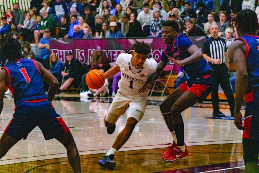 Junior guard Christian Speller drives into the paint during a game against MSU-D on Feb. 27. Speller was the second leading Maverick scorer with 16 points after a 21-point showing versus Mines the night before. 
\\ Westin Winter for The Criterion