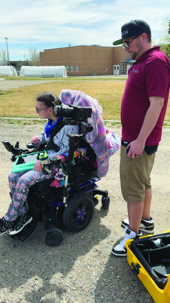 Wheel chair filming with camera. -The Criterion