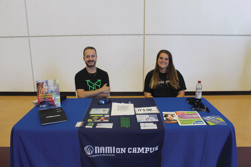 Members of CMU’s club softball team show off smiles at their table.