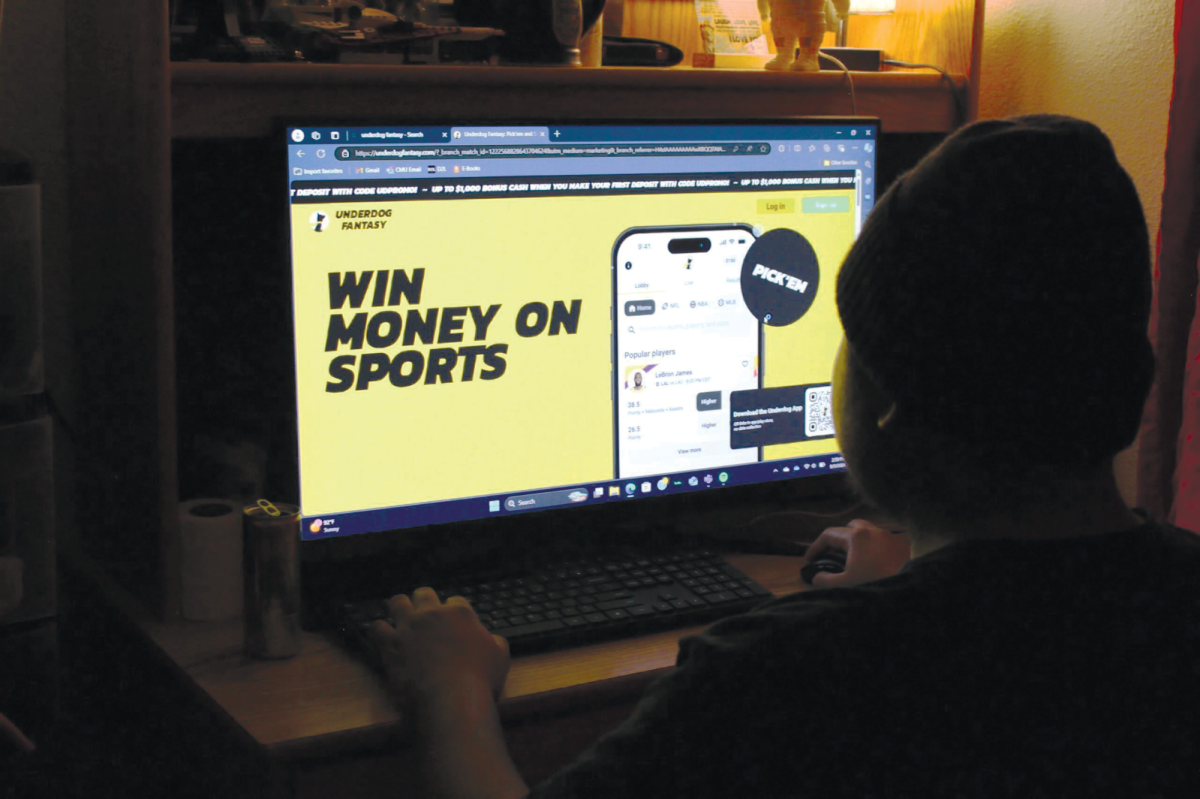 Criminal Justice sophomore Fernando Ayona perusing betting services in his dorm.