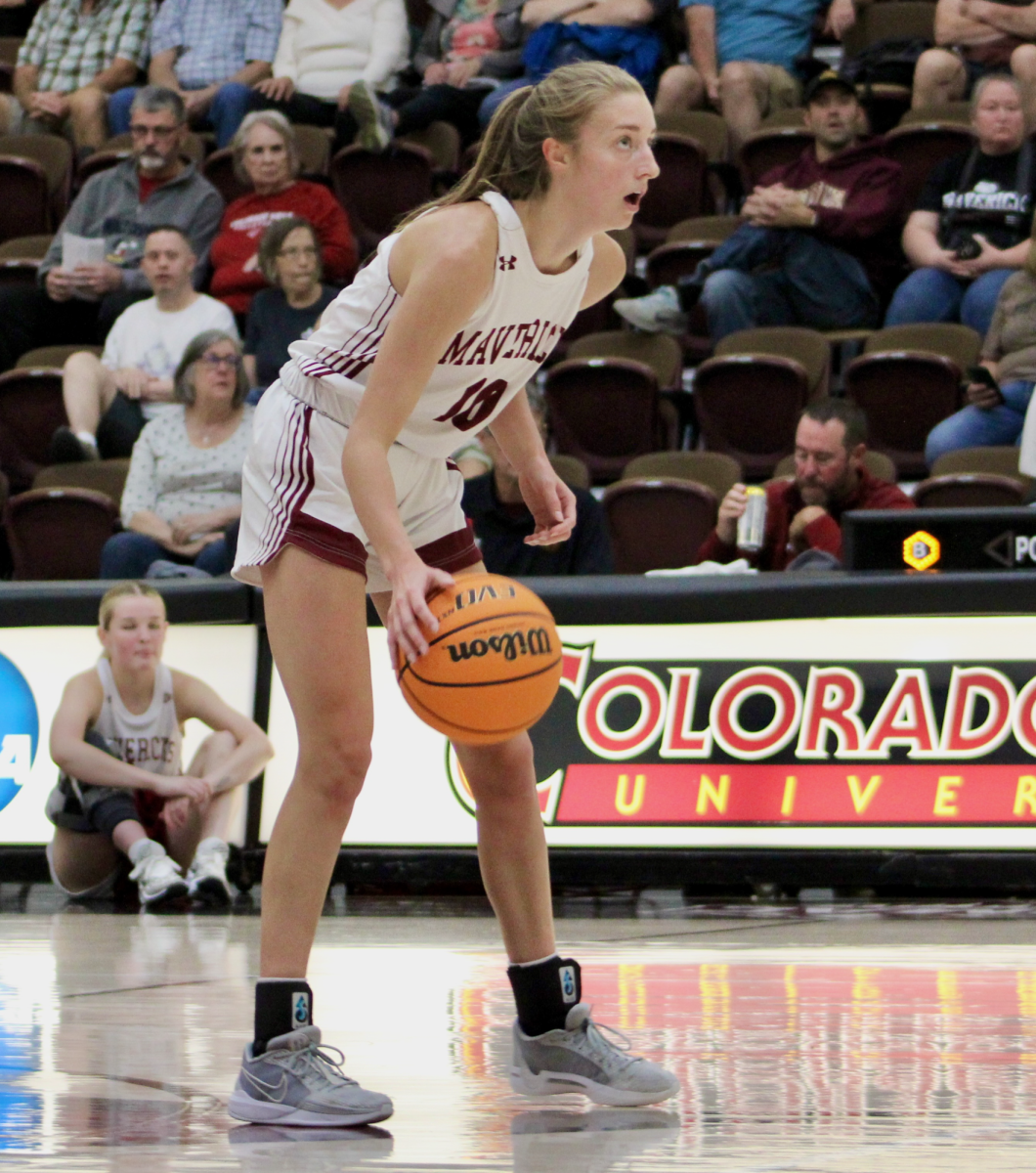 Guard Kylie Kravig sets up the offense in a pre-season game. In the teams first regular season game on the road, Kravig set the all time assist mark with 374 in her career.