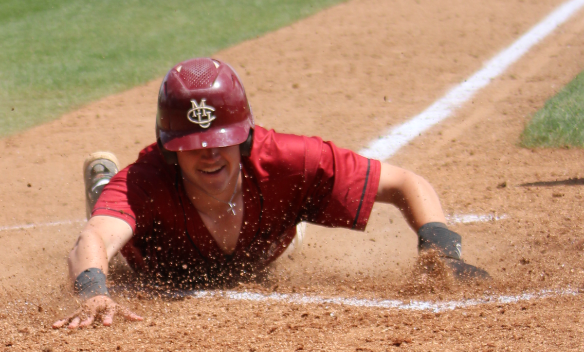 Then junior Paul Schoenfeld sliding into home in a contest against the New Mexico Highlands University Cowboys last year. Schoenfeld hit .412 last year, chipping in six home runs, 15 extra base hits, and 40 runs batted in.
  \\ Jordan Messler for The Criterion