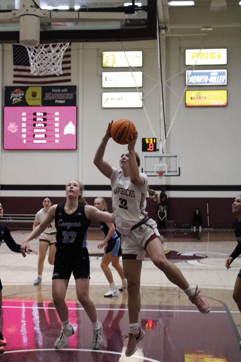 Olivia Reed-Thyne clears the paint to score a layup against Colorado Christian University at a home contest at Brownson arena. Reed-Thyne leads the Mavericks in scoring at 22.3 points per contest.
 \ Jordan Messler for The Criterion