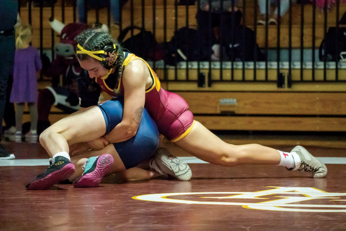 Senior 145 pounder Erica Smith in the Fall Brawl against Snow College. Smith is 15-6 in the 24-25 campaign, going 5-1 in duals She's also forced six pins, with her fastest one coming in a blazing 14 seconds. 
\ Shelby Streeter for The Criterion