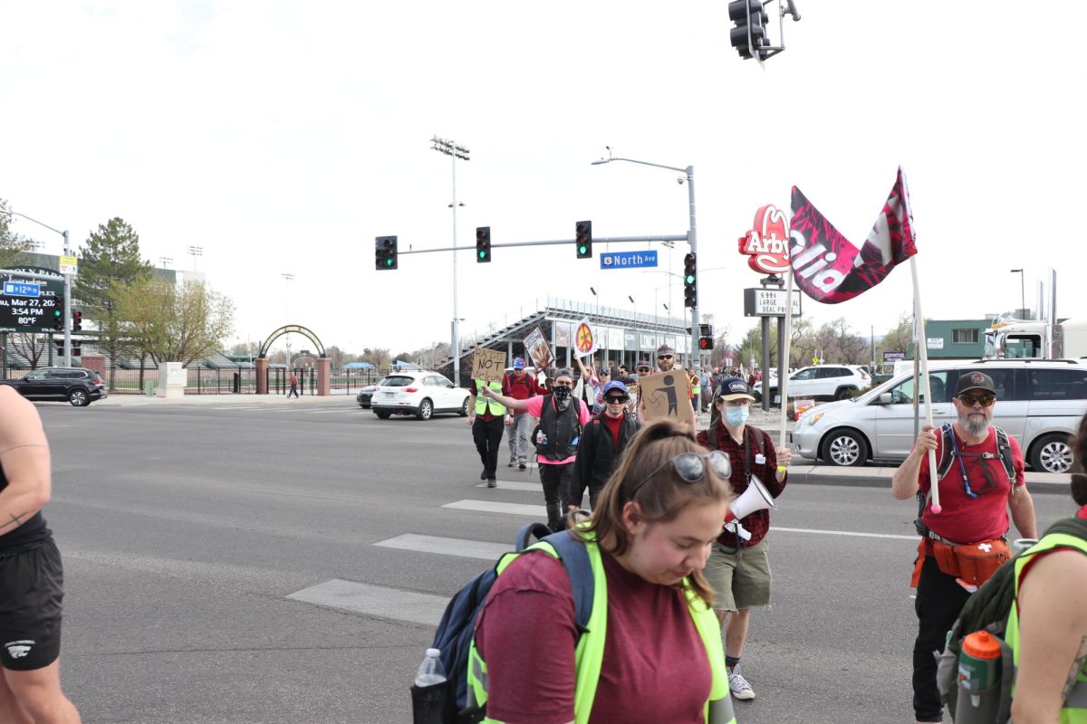 A group of protestors crossing North towards CMU. These protestors believe the university has platformed white supremacy.
