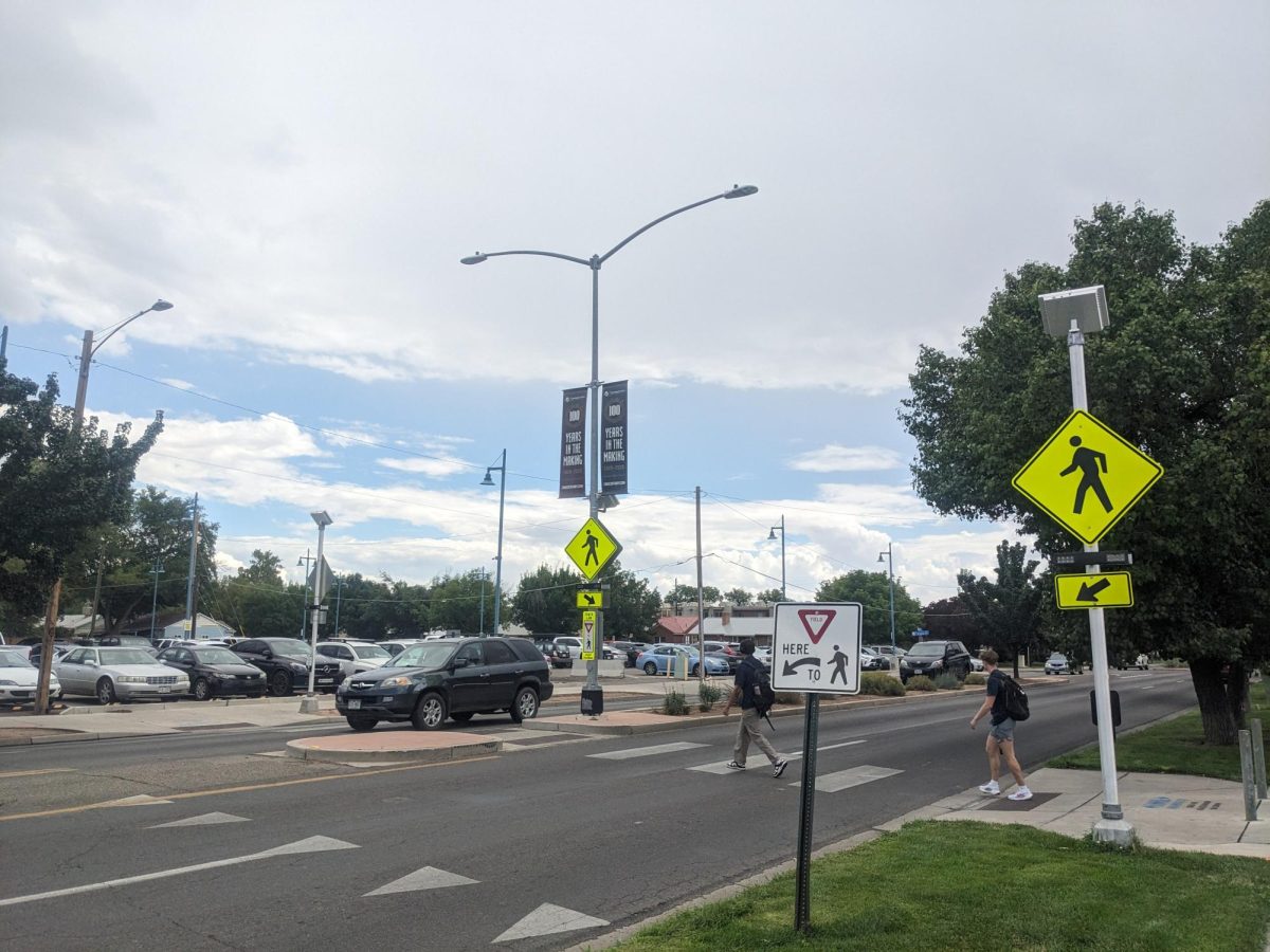 The crosswalk where the student was struck in broad daylight. The flashing lights are supposed to alert drivers of the presence of pedestrians. This is a common traffic calming device in high pedestrian areas.