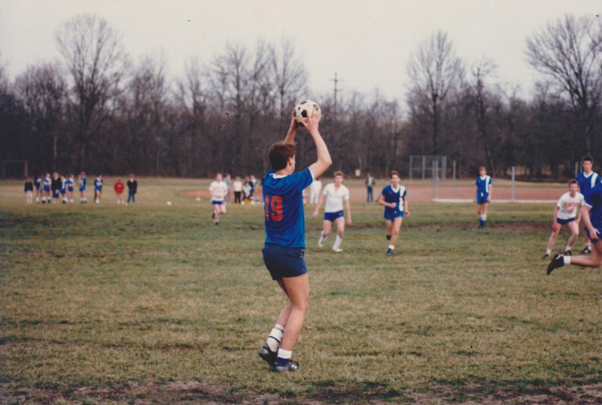 Albert Dunn (19) during a throw-in at one of his high school soccer matches. His daughter Sarah credits her father for being the reason behind her jersey number at CMU.  //Courtesy of the Dunn Family