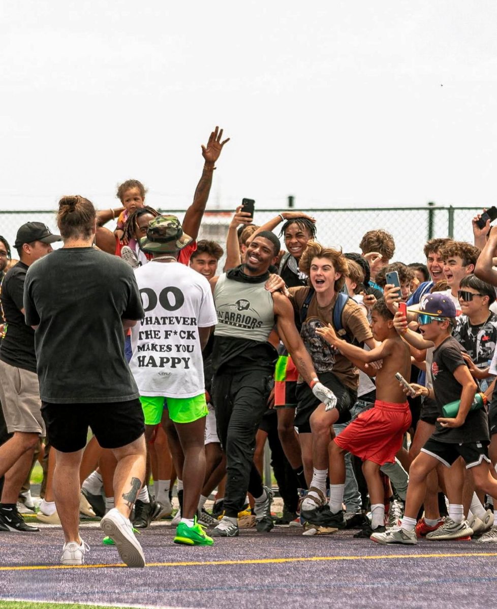 Senior Malik Manuel (center) struts his way down the field after winning $10,000. Manuel noted that this was one of the few moments he had ever shown so much emotion, and understandably so.
Courtesy of Malik Manuel
