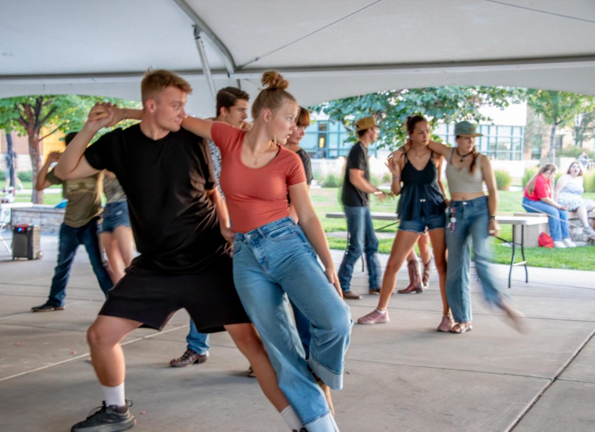 CMU Swing Dancing Club members learn to dip as part of the advanced swing combo. They offer beginner and advanced combos each meeting for students of all experience levels.