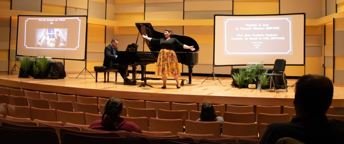 Soprano Dr. Melissa Lubecke Sarabia belts out “Me Alquilo para Soña” while Steven Agulió-Arubes plays the piano in the background. They worked with CMU vocal students earlier that day to increase their technical singing knowledge.
