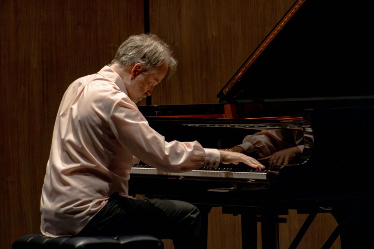 Brian Krinke telling his story through the piano. He memorized all six pieces for the performance which signified his respect for the art.