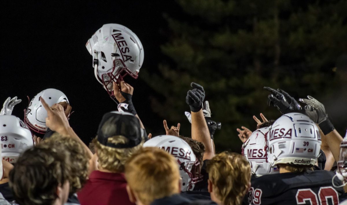 CMU Football players break the huddle with hands and helmets held in the air after defeating Eastern New Mexico University on Sept. 6. The postive energy in the stadium motivated players to perform their best.