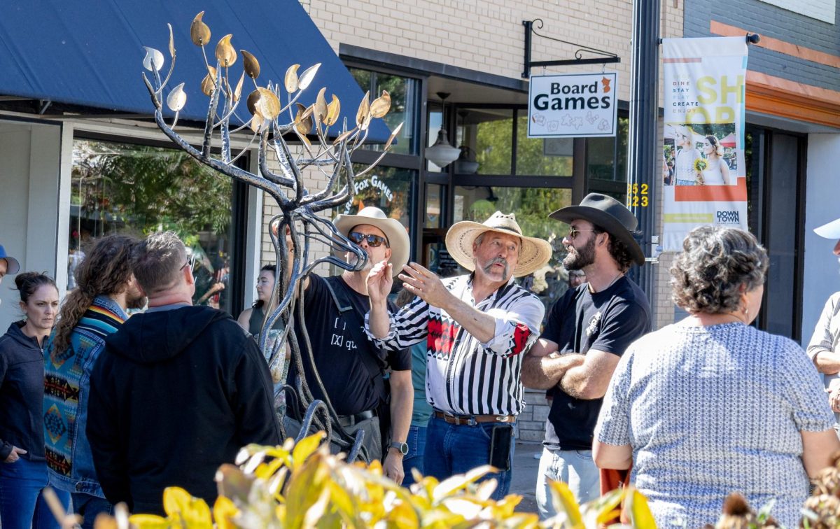  On the second day of the Downtown Art Festival, many groups showcased art related to culture and movement: Artists, judges and casual attendees admired one of 22 new Art on the Corner installations. 
