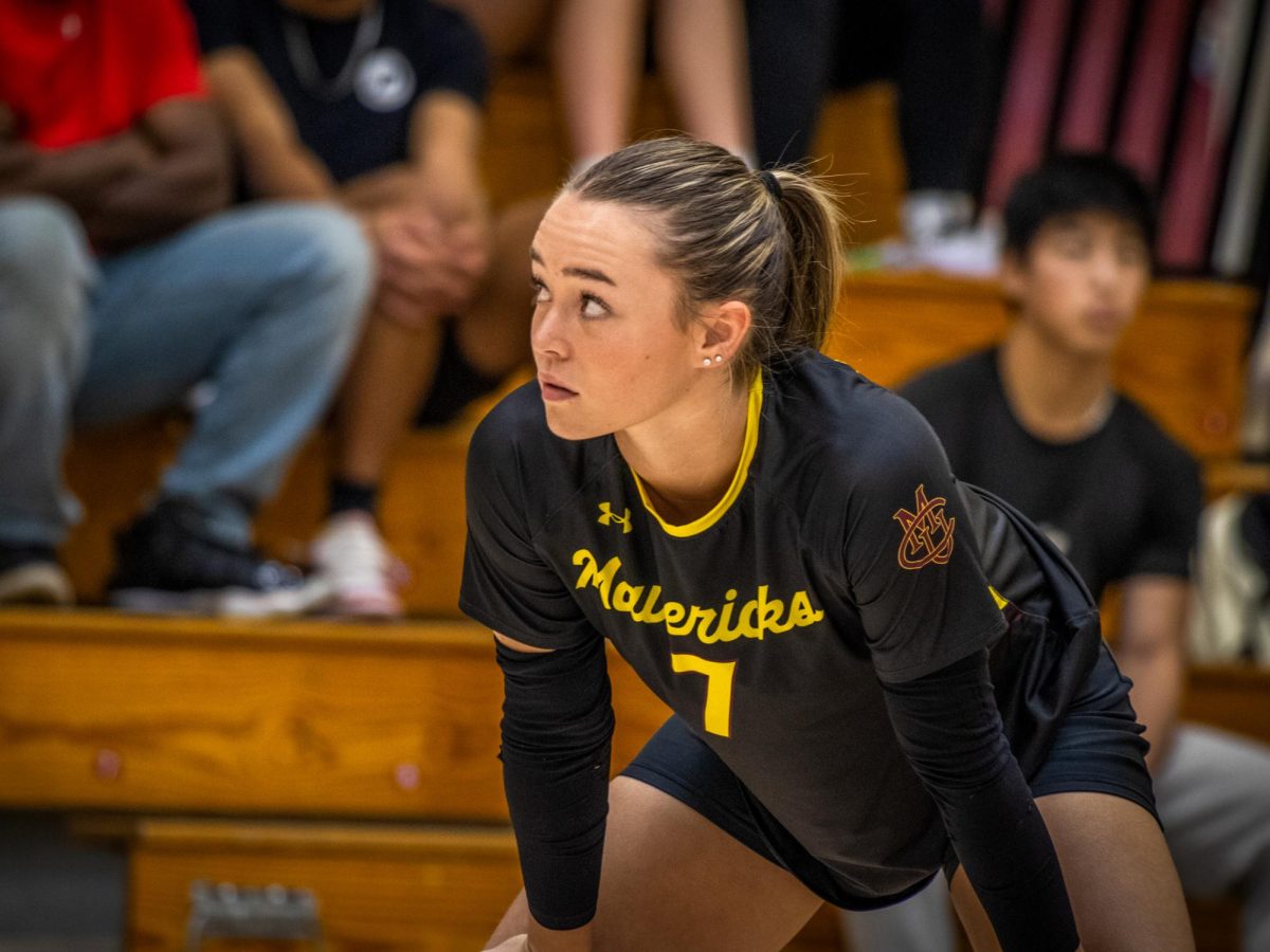 Junior libero Marli Clausi checks the scoreboard during Saturday’s match versus UCCS. The Mountain Lions came into the match at an undefeated 11-0, and though CMU stayed within arms reach, they ultimately fell short, losing 2-3. 