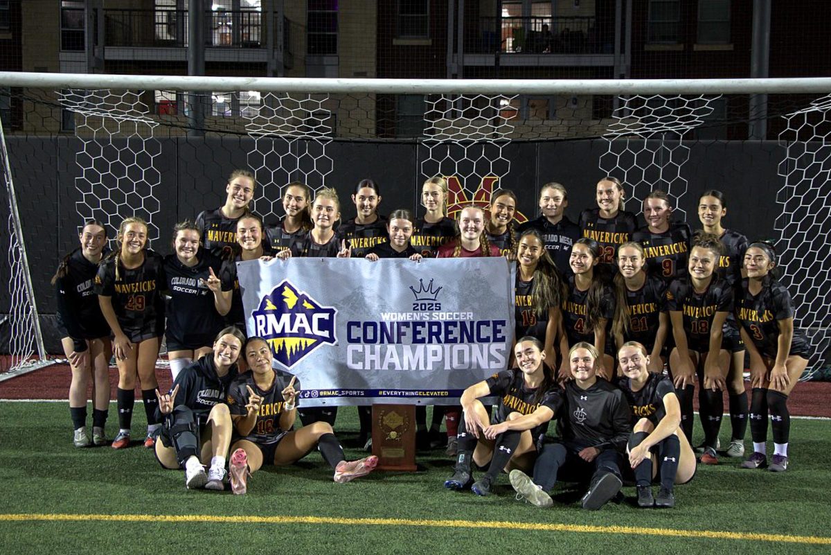 The CMU Women’s Soccer team poses for a picture with their Conference Champions banner. The Mavs finished with a 14-2-2 record, winning the RMAC with a 9-0-2 RMAC record.