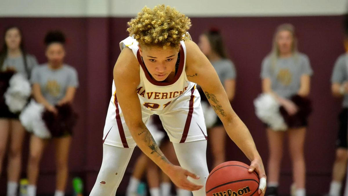 Former CMU women’s basketball player Sydni Brandon dribbles a basketball across the court during the 2019-2020 season. After leaving CMU to work as a basketball coach, and later being terminated, Brandon filed a lawsuit against her former employers at District 51 due to alleged “unlawful termination” and discrimination. //Courtesy of CMU Athletics
