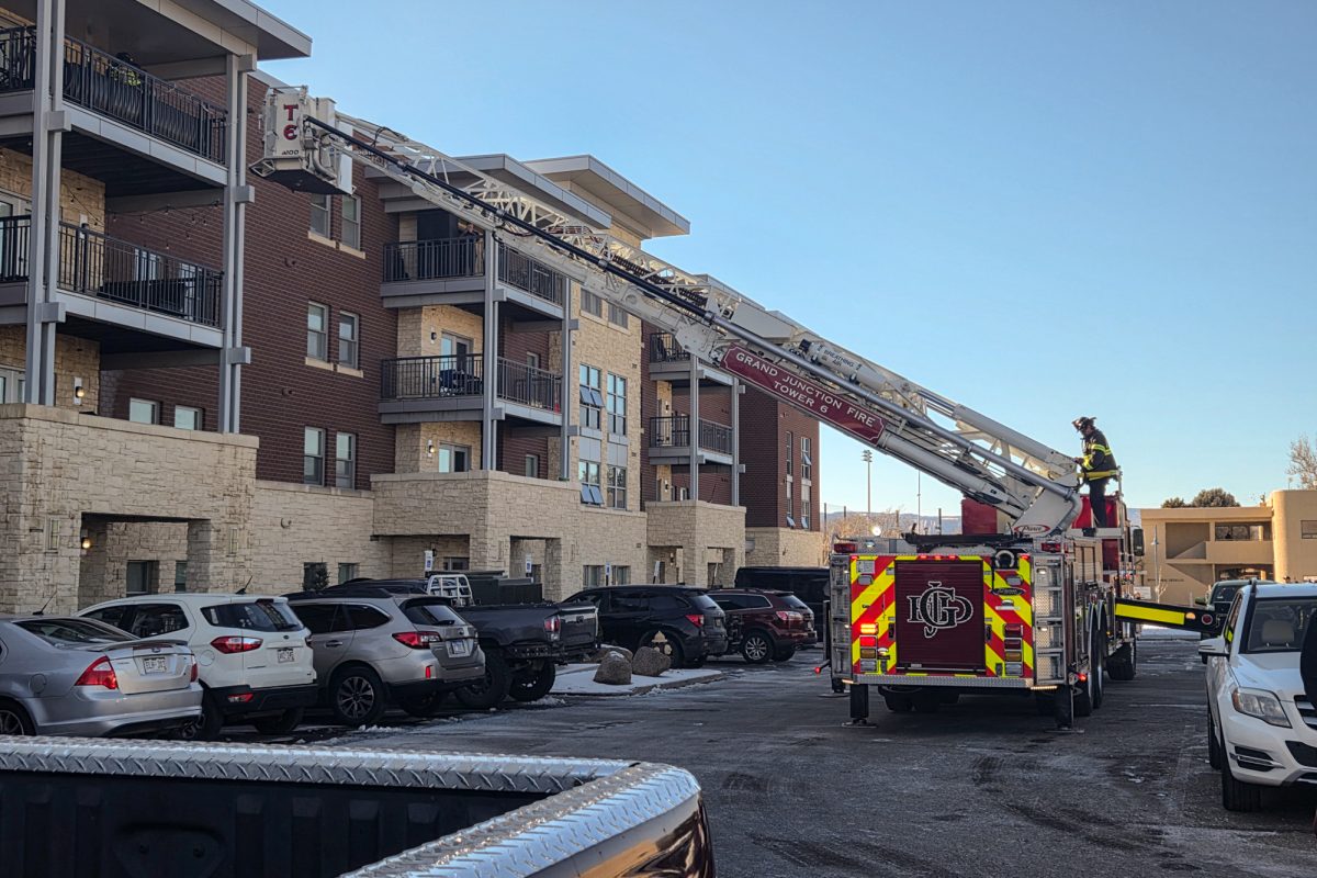 A ladder extends towards the roof of the Orchard Apartments on campus. Students, RAs and other staff evacuated the apartments after a broken sprinkler triggered the fire alarm on Jan. 27.