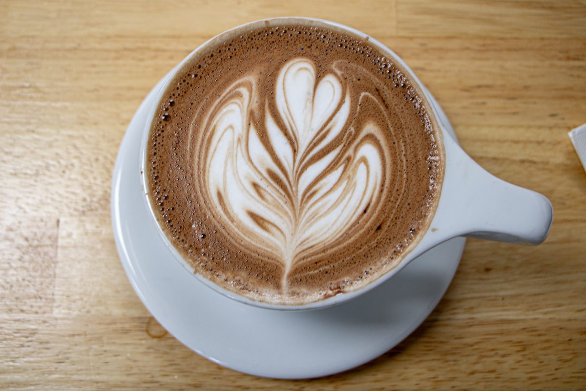A fresh latte from Kiln Coffee Bar finished by expert barista hands with beautiful latte art. Located in downtown Grand Junction on Main Street, Kiln is a hub for the community. Barista John Cook had been a customer before joining the team and isn’t looking back.