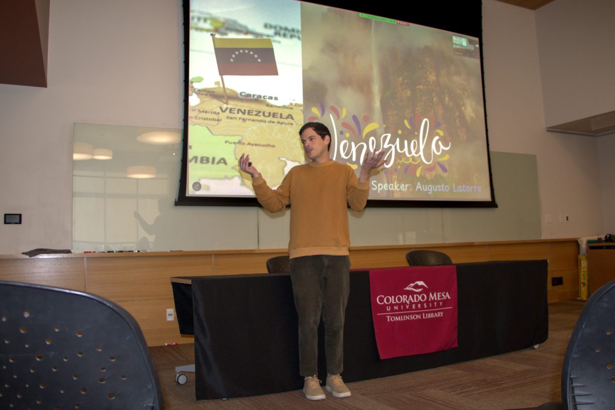 Augosto Latorre, a first semester biology major from Venezuela presents his Cultural Cafe on the country. Cultural Cafe is an opportunity to explore different cultures through food and to connect with members of the community.