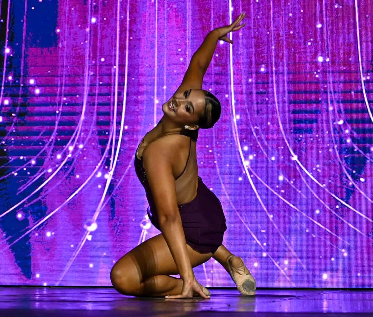 Freshman dancer Danni Keene performs at Denver Showstoppers regional dance competition. She has been attending Nuggets Cheer Squad camps in Denver on weekends. At 18, she is one of the youngest attendees at the camps and hopes to try out for the professional cheer team in the summer. 