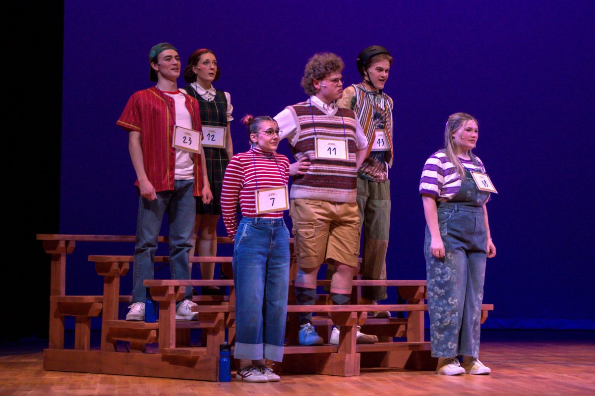 The cast of “The 25th Annual Putnam County Spelling Bee” lines up to compete in the school spelling bee. From left to right: Guerin Smith (Chip Toletino), Abigail Smith (Macy Park), Lucy Amann (Logainne Schwartzandgrubennire), Garrison T. Herbert (William Barfee), Levi Hughes (Leaf Coneybear) and Annalyn Milford (Olive Ostrovky).