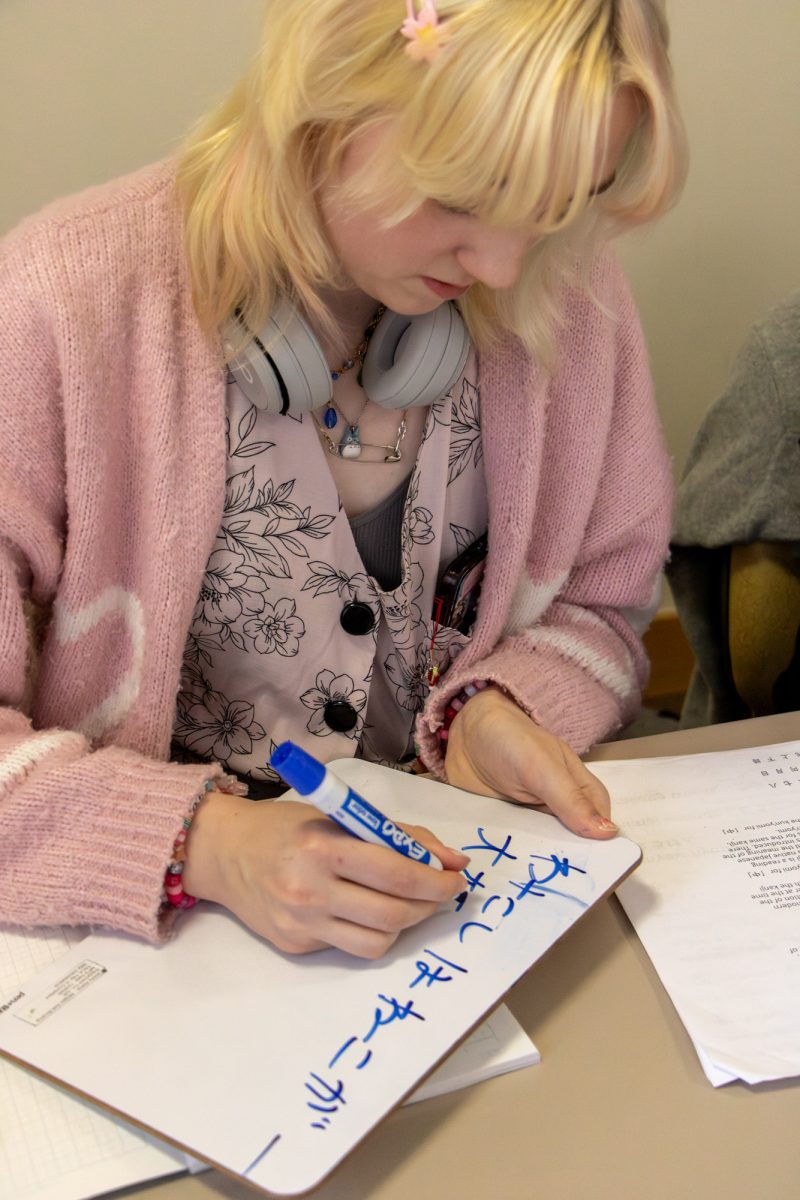 Concurrent freshman at Grand Junction High School Tegwin Ferguson writing in kanji during a practice prior to Japan Cup.